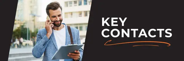 Man on the phone looking at clipboard